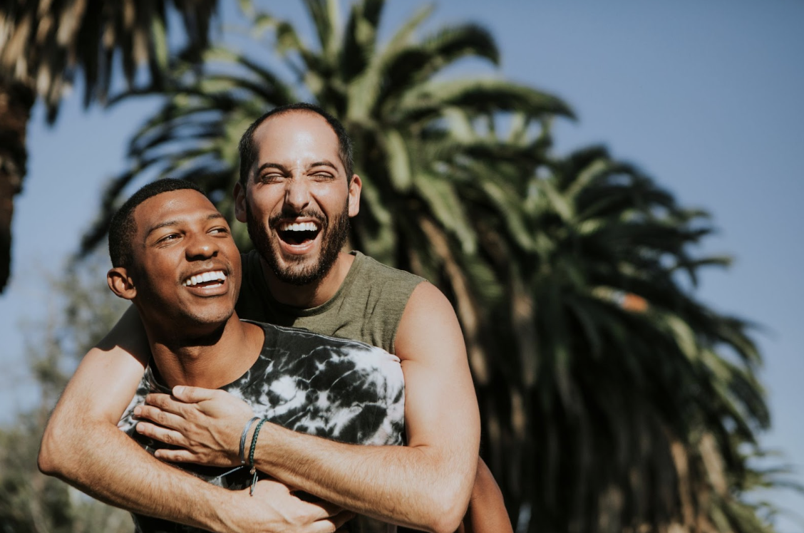 two lovers laughing and hugging